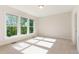 Carpeted bedroom with large windows offering plenty of natural light at 66 Sweet Meadow Ln, Pittsboro, NC 27312