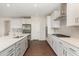 New kitchen features a modern island, stainless appliances and elegant cabinetry at 66 Sweet Meadow Ln, Pittsboro, NC 27312