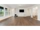 Open concept living room with hardwood floors, neutral walls, and recessed lighting at 66 Sweet Meadow Ln, Pittsboro, NC 27312