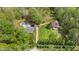 Aerial view of a sprawling property with a pool, barn, and well-maintained grounds, showcasing its vast potential at 6971 Shady Creek Trl, Rougemont, NC 27572