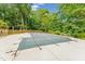 The in ground pool is covered for protection during the off season, surrounded by a wood fence at 6971 Shady Creek Trl, Rougemont, NC 27572