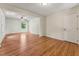 Expansive living room with hardwood floors, a ceiling fan, and an open layout, perfect for entertaining and comfortable living at 6971 Shady Creek Trl, Rougemont, NC 27572