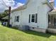 Exterior of home with vinyl siding, chimney, and green lawn at 705 Washington St, Graham, NC 27253