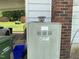 Exterior of home featuring AC unit and trash cans at 705 Washington St, Graham, NC 27253