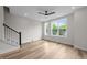 Bright and airy bedroom with hardwood floors, large windows, and recessed lighting at 710 W North St # 101, Raleigh, NC 27603