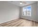 Cozy bedroom with a ceiling fan and natural light, showcasing wood floors at 710 W North St # 101, Raleigh, NC 27603