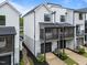 View of exterior showing modern townhomes with screened in porches at 710 W North St # 101, Raleigh, NC 27603