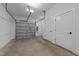 Spacious two car garage featuring an insulated garage door and ample storage space at 710 W North St # 101, Raleigh, NC 27603