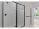 Walk-in shower features black hardware, white subway tile, and recessed shelving at 710 W North St # 101, Raleigh, NC 27603