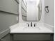 Bathroom with a modern sink, mirror, and stylish gray vanity at 80 Water Willow Ln, Zebulon, NC 27597