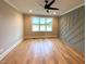 This bedroom features hardwood floors, crown molding, and a ceiling fan at 80 Water Willow Ln, Zebulon, NC 27597