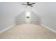 Spacious bonus room featuring neutral carpet and built-in shelves at 80 Water Willow Ln, Zebulon, NC 27597