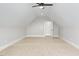 Spacious bonus room with neutral carpet and vaulted ceilings at 80 Water Willow Ln, Zebulon, NC 27597