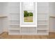 Walk-in closet featuring custom built-in shelving, providing ample storage and organization options at 80 Water Willow Ln, Zebulon, NC 27597