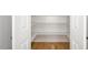 This spacious closet features hardwood floors and built-in shelving at 80 Water Willow Ln, Zebulon, NC 27597