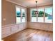 Bright dining space with large windows, elegant trim, and a stylish light fixture for memorable meals at 80 Water Willow Ln, Zebulon, NC 27597
