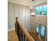 Elegant entryway showcasing a modern chandelier, soaring ceilings, and stylish wood and iron staircase at 80 Water Willow Ln, Zebulon, NC 27597