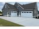 Spacious three-car garage offering ample parking and storage space, enhancing the home's functionality at 80 Water Willow Ln, Zebulon, NC 27597