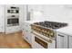 A stainless steel range and white cabinetry complement the kitchen's modern design at 80 Water Willow Ln, Zebulon, NC 27597