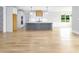 Open kitchen layout features a large island, hardwood floors, and recessed lighting at 80 Water Willow Ln, Zebulon, NC 27597