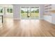 Light-filled living area with hardwood floors and sliding glass doors leading to the outside at 80 Water Willow Ln, Zebulon, NC 27597