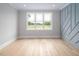 Bright room with large window and detailed wall trim at 80 Water Willow Ln, Zebulon, NC 27597