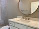Bathroom showcasing quartz countertop, white vanity, and bronze hardware at 90 Water Willow Ln, Zebulon, NC 27597