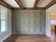 Dining room with decorative wall trim, wooden beams, and a large window bringing in plenty of light at 90 Water Willow Ln, Zebulon, NC 27597