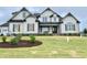 Stunning two-story home featuring beautiful wood shutters, a manicured lawn and meticulous landscaping at 90 Water Willow Ln, Zebulon, NC 27597