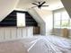Open loft space featuring open shelving, wet bar, and natural light at 90 Water Willow Ln, Zebulon, NC 27597
