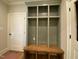 Functional mudroom with built-in storage lockers, bench seating, and coat hooks at 90 Water Willow Ln, Zebulon, NC 27597