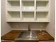 Convenient utility sink with wood countertop and plenty of shelving storage at 90 Water Willow Ln, Zebulon, NC 27597