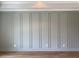 Stylish wainscoting wall with decorative trim and modern electrical outlets at 90 Water Willow Ln, Zebulon, NC 27597
