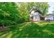 Well-maintained backyard featuring a lush green lawn and an outdoor dining area at 9021 Albatross Ct, Raleigh, NC 27613
