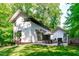 Modern home featuring an outdoor dining space and lush green yard at 9021 Albatross Ct, Raleigh, NC 27613