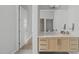 Modern bathroom vanity with quartz countertop and wood cabinets at 9021 Albatross Ct, Raleigh, NC 27613