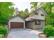 Contemporary home with a stylish facade, attached garage and modern design elements at 9021 Albatross Ct, Raleigh, NC 27613