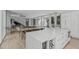 Spacious kitchen with quartz island, wine storage, and open floor plan with view to the living area at 9021 Albatross Ct, Raleigh, NC 27613