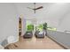 Bright living area with comfortable beanbag chairs, bookcase, and tree views at 9021 Albatross Ct, Raleigh, NC 27613