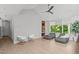 Spacious living area features natural light, modern ceiling fan, and cozy beanbag seating at 9021 Albatross Ct, Raleigh, NC 27613