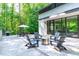 Modern patio with a fire pit and outdoor seating area, perfect for entertaining at 9021 Albatross Ct, Raleigh, NC 27613