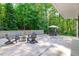 Expansive patio with outdoor seating, a dining table, and a built-in grill at 9021 Albatross Ct, Raleigh, NC 27613