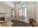 Spacious living room featuring a unique stained-glass window and vintage chandelier at 903 Nicholas St, Henderson, NC 27536