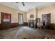 Spacious room with fireplace and wood paneling at 903 Nicholas St, Henderson, NC 27536