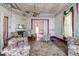 Living room with floral accents, a decorative fireplace, and large window at 903 Nicholas St, Henderson, NC 27536
