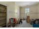 Unfurnished room featuring a window, shelving, and old carpeting at 903 Nicholas St, Henderson, NC 27536