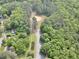 Overhead view of a neighborhood park with trees, parking and a baseball field at 913 Tyrrell Rd, Raleigh, NC 27609
