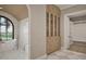 Bathroom featuring walk-in closet, standalone tub, and marble patterned walls at 913 Tyrrell Rd, Raleigh, NC 27609