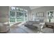 Bright bedroom with large window offering scenic backyard views and light gray decor at 913 Tyrrell Rd, Raleigh, NC 27609