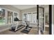 Bright home gym with workout equipment and ample windows offering serene outdoor views at 913 Tyrrell Rd, Raleigh, NC 27609